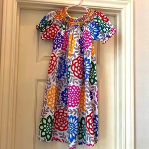 Colorful, fun dress with floral print and smocked collar.  Puffed sleeves.